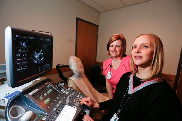 From peace signs and waves to martial arts kicks, prenatal ultrasound techs Shelly Kemppel (on left) and Jen Burnett have seen it all.