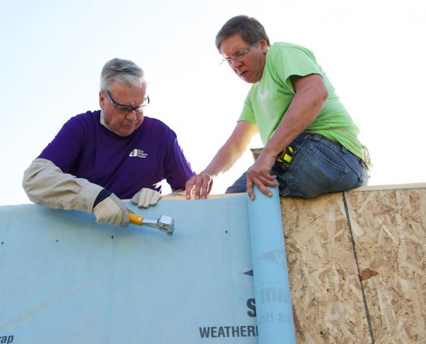 Bill Considine helps build a house for Habitat for Humanity