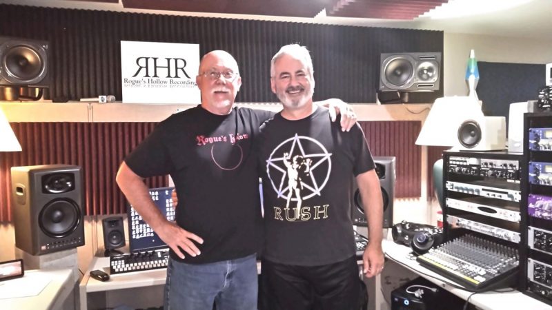 Chuck Reid with friend at recording studio